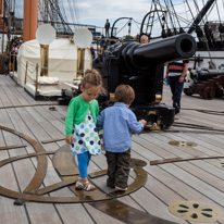 Portsmouth - 09 August 2013 / Thomas and Alana playing on the Warrior