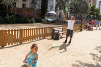 Barcelona - 23 August 2013 / Big bubbles of soap in front of the Sagra de la Familia.