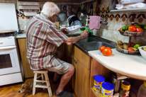 Sant Boi - 24 August 2013 / The grand dad preparing some food and cleaning a few dishes. He is such a nice guy...