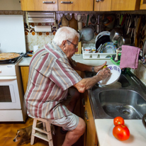 Sant Boi - 24 August 2013 / The grand dad preparing some food and cleaning a few dishes. He is such a nice guy...