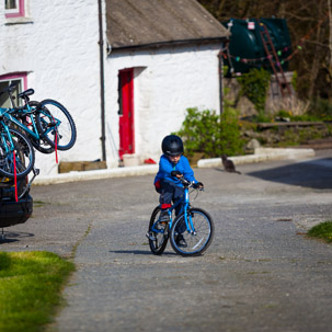 Dinas Island - 15 April 2014 / Oscar riding his bike by the cottage