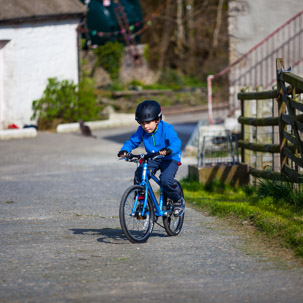 Dinas Island - 15 April 2014 / Oscar riding his bike by the cottage