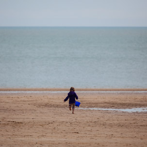 Tenby - 17 April 2014 / Alana trying to empty the sea...