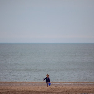 Tenby - 17 April 2014 / Alana trying to empty the sea...