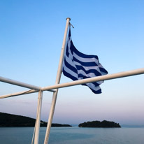 Crossing from Corfu to Ougemitsa - 20 August 2017 / Greek flag on the boat
